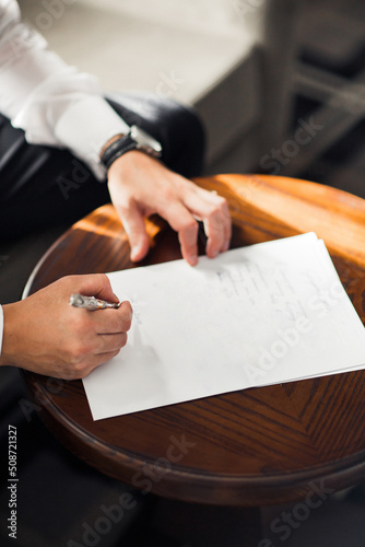 Groom is writing a letter to his beloved bride