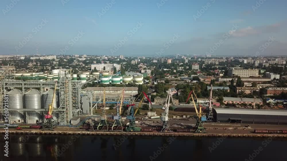 Aerial view of the international commercial port.Shipping cargo to harbor by crane. Water transport International. Logistic industry, freight transportation business concept. Aerial view of the international commercial port.Shipping cargo to harbor by crane. Water transport International. Logistic industry, freight transportation business concept.