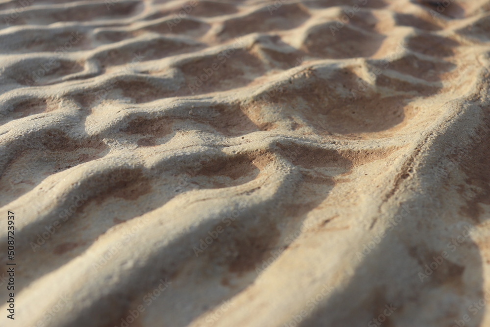 sand that forms waves, due to waves of water currents. natural background sand that forms waves, due to waves of water currents. natural background