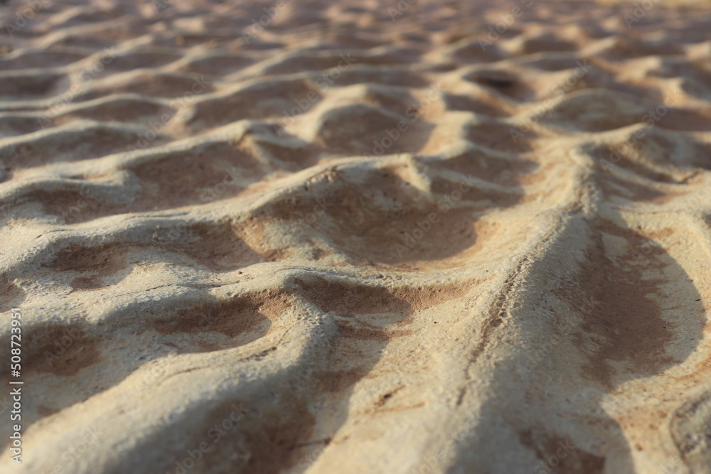 sand that forms waves, due to waves of water currents. natural background sand that forms waves, due to waves of water currents. natural background