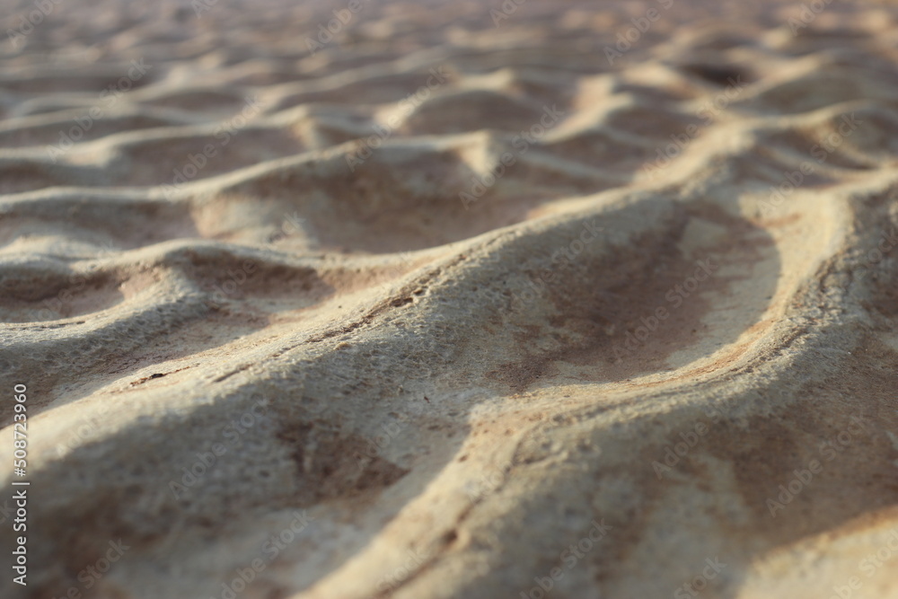 sand that forms waves, due to waves of water currents. natural background sand that forms waves, due to waves of water currents. natural background