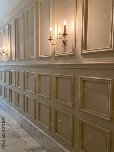 Interior wall panels with candle shape lights, dim light year 2022 summer Tokyo Japan city
