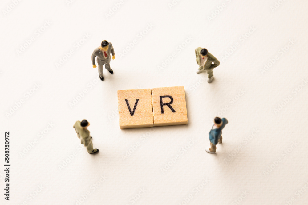 businessman figures at vr words