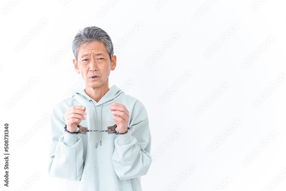 逮捕された高齢の男性 逮捕された高齢の男性