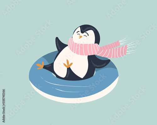 Cute penguin in a scarf on snow tube. Funny character in winter. Isolated.