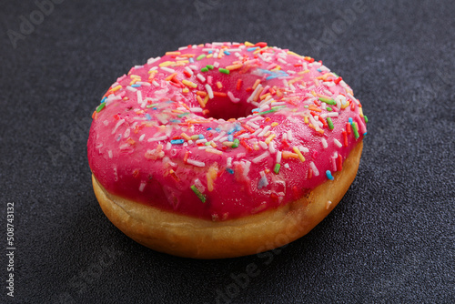 Sweet glazed struwberry donut with icing