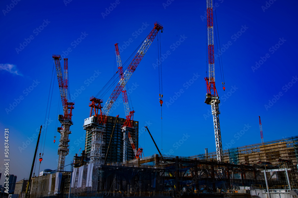 Cranes at the under construction in Tokyo wide shot