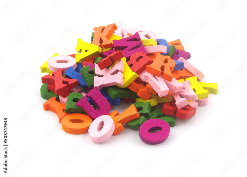 Heap of colorful letters isolated on white close-up. Heap of colorful letters isolated on white close-up.
