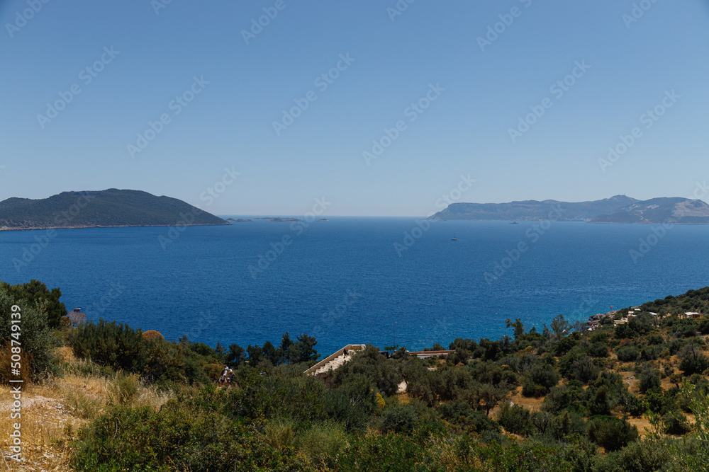Beautiful view of the bay with ships and mountains. Sea bay with luxury yachts on the coast of Turkey. Colorful, summer landscape. Travel concept. Aegean Sea. Journey. Sea Voyage