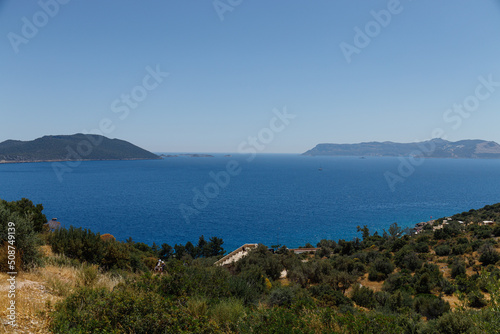 Beautiful view of the bay with ships and mountains. Sea bay with luxury yachts on the coast of Turkey. Colorful, summer landscape. Travel concept. Aegean Sea. Journey. Sea Voyage