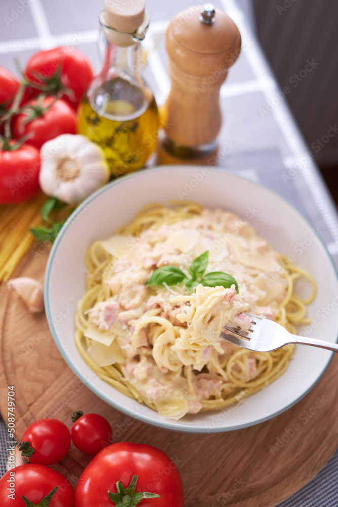 homemade pasta carbonara with fresh basil and parmesan in ceramic dish homemade pasta carbonara with fresh basil and parmesan in ceramic dish