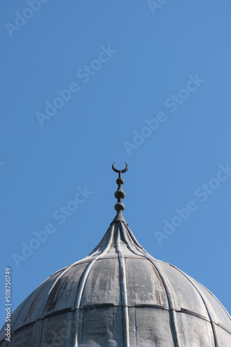 mosque dome and crescent symbol covered with lead sheet. Ulucami. The Great Mosque of Adana, Turkey photo