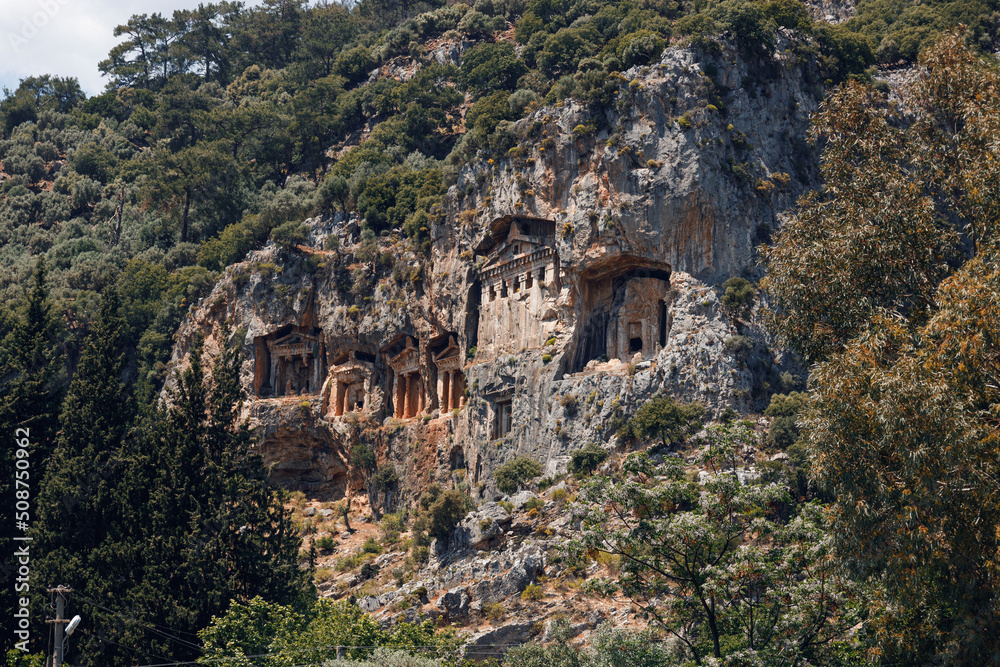 Archaeological remains of the Lycian rock cut tombs. Lycian Tombs. Unique ancient necropolis. Ancient Greek burials. Tourism and attractions. River Dalyan, Turkey. Lycian Tombs Of Caunos