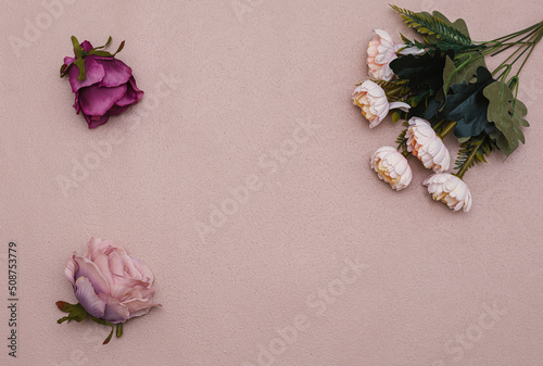 roses on textured background, top view
