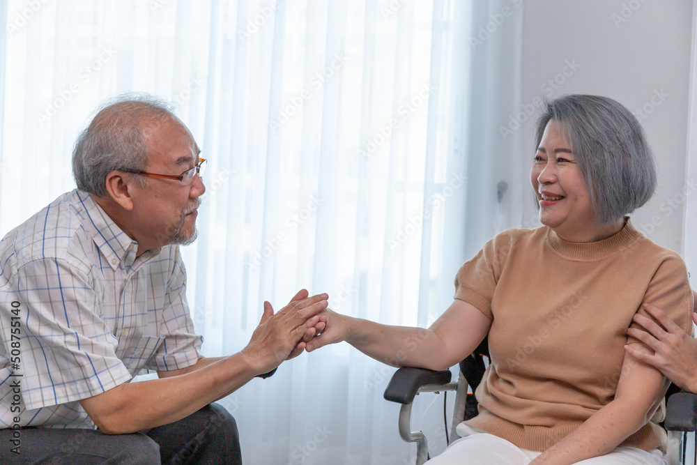 A happy retired couple looking each other at home.