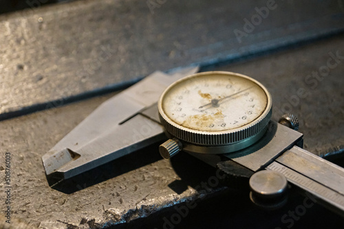 Closeup of a measuring special equipment like vernier of old Lathe Machinery. Vintage Industrial Machinery in a old factory. Selective focus.