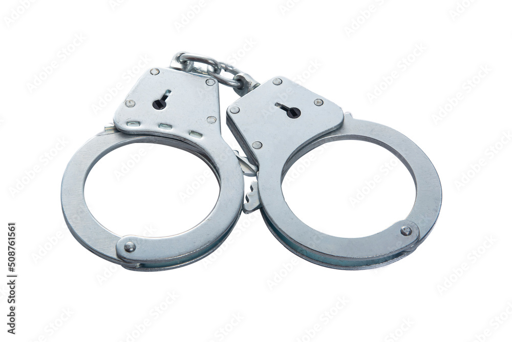 Metal handcuffs on a white isolated background, copy space Metal handcuffs on a white isolated background, copy space