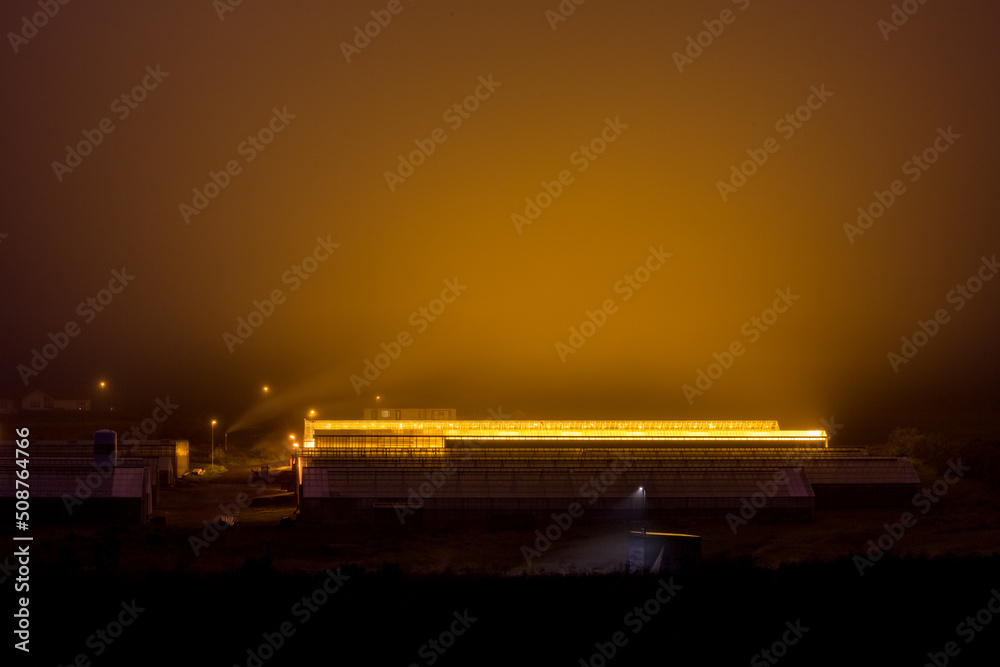 Night long exposure photograph of a greenhouse. Iceland in the summer. Photographic travel around the island. Night long exposure photograph of a greenhouse. Iceland in the summer. Photographic travel around the island.