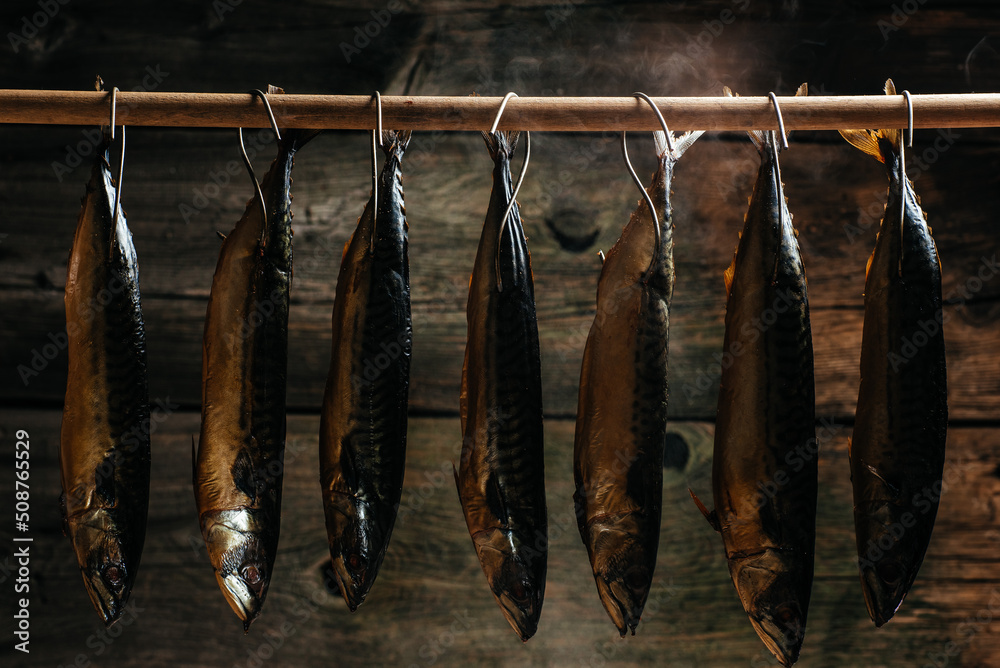 Smoked fish in smokehouse. Smoking Process Fish. Smoking fish hanging side  by side in a smoker Stock Photo | Adobe Stock