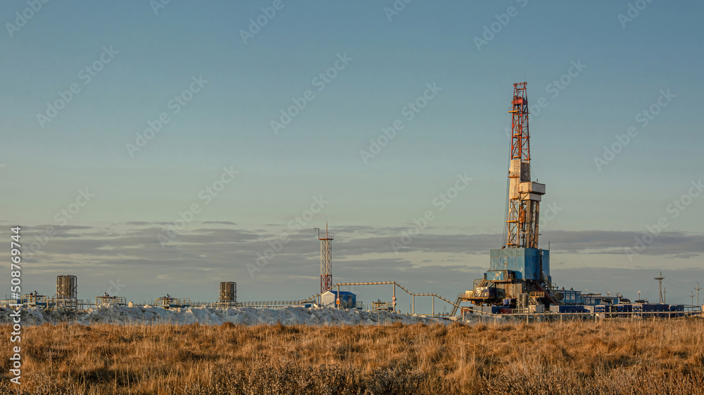 A general view of a drilling rig for drilling wells at an oil and gas field in the Arctic region. Winter. Day. Drilling equipment and technical infrastructure