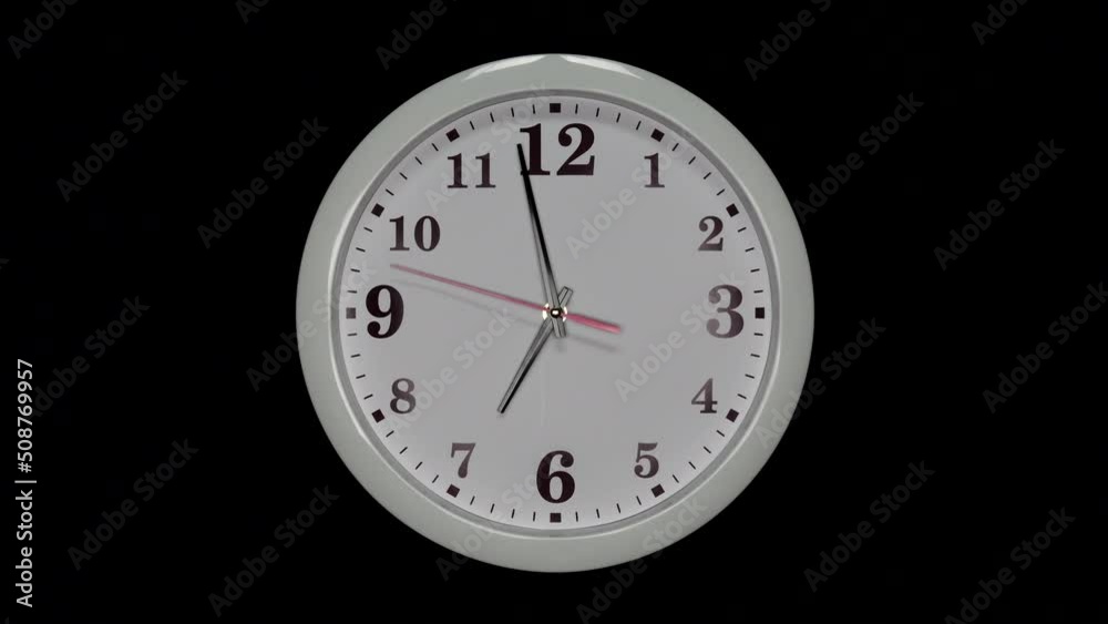 White Wall Clock With A Black Arrows And Red Second Hand On Black Background. Wall Clock Face Of Time Of 7.00 Am Or Pm. 4k. ProRes. White Wall Clock With A Black Arrows And Red Second Hand On Black Background. Wall Clock Face Of Time Of 7.00 Am Or Pm. 4k. ProRes.