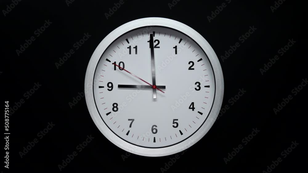 Black Arrows And Red Second Hand Of Grey Wall Clock. Black Background. Wall Clock Face Beginning Of Time Of 9.00 Am Or Pm. 4k. ProRes. Black Arrows And Red Second Hand Of Grey Wall Clock. Black Background. Wall Clock Face Beginning Of Time Of 9.00 Am Or Pm. 4k. ProRes.