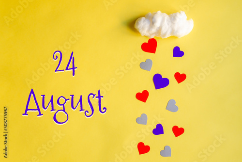 24 august day of month, colorful hearts rain from a white cotton cloud on a yellow background. Valentine's day, love and wedding concept