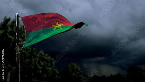 Burkina Faso flag for any holiday on dark storm cumulus - abstract 3D rendering