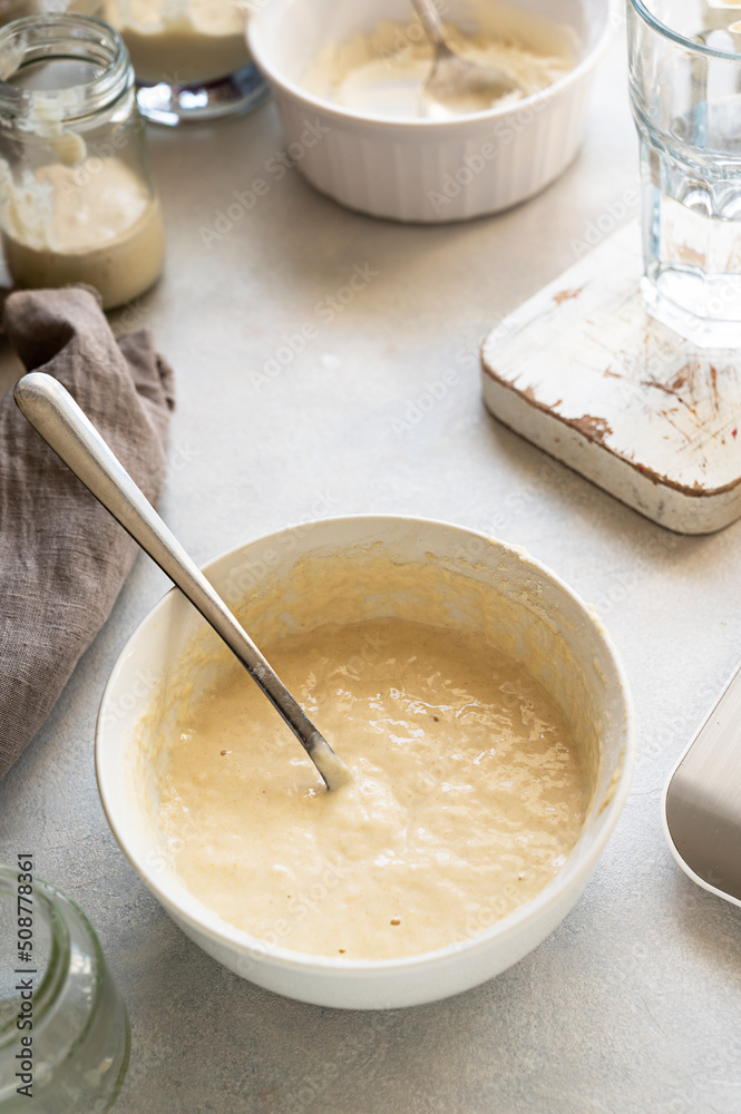 Homemade breadmaking with sourdough using wild yeast, busy lifestyle scene of baking at home, top view. Sustainable living Homemade breadmaking with sourdough using wild yeast, busy lifestyle scene of baking at home, top view. Sustainable living