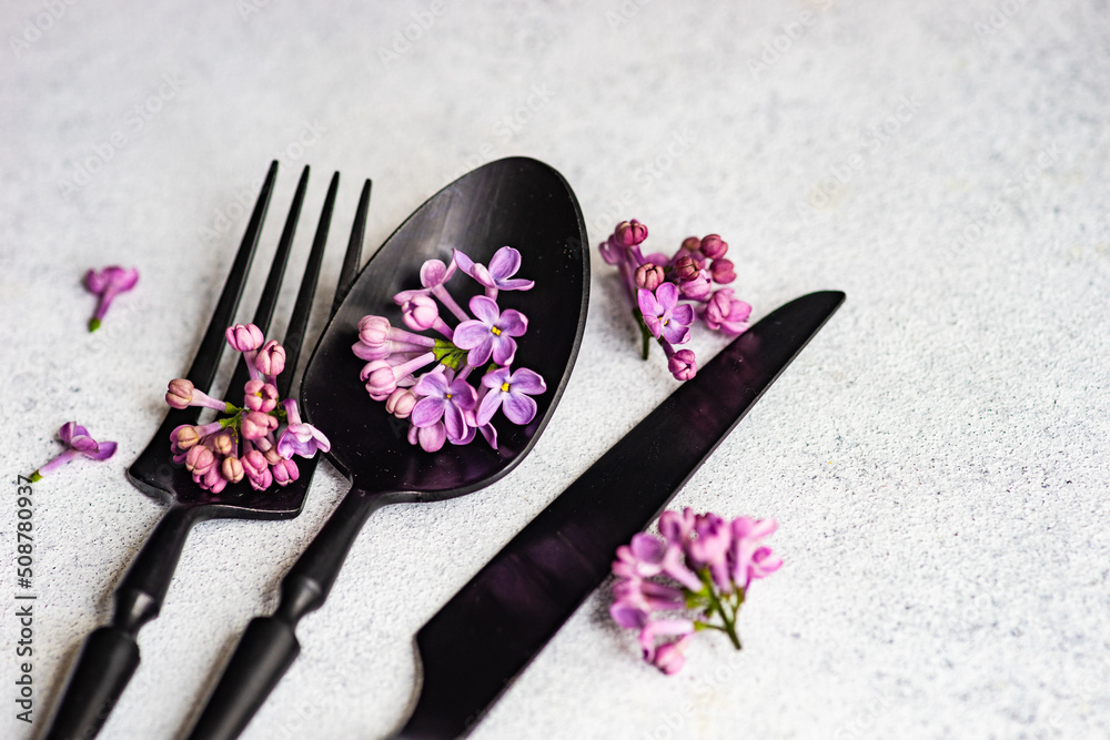 Spring place setting with lilac flowers Spring place setting with lilac flowers