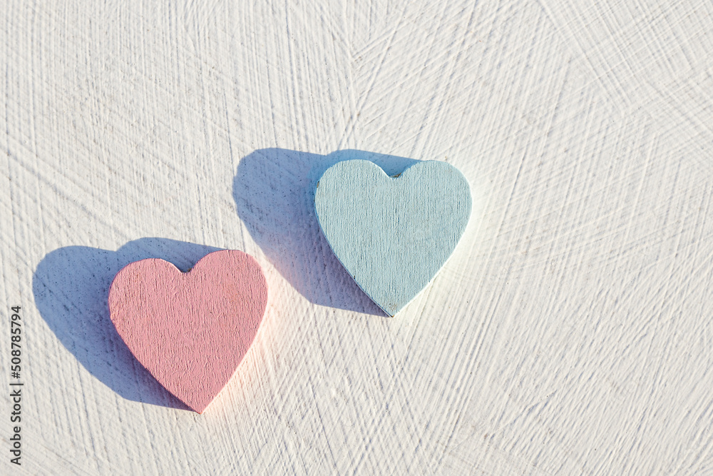 two wood hearts cast shadows two wood hearts cast shadows