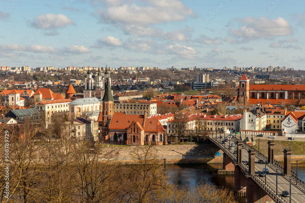 Naklejka premium View from Aleksotas Hill to Kaunas Old Town, to Vytautas the Great bridge and to Neman river, from distance visible newer part of the town. View to Kaunas from top of the hill of Aleksotas.