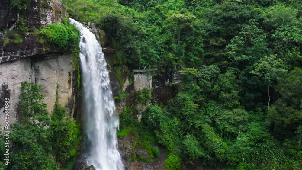 A tropical waterfall in the jungles Ramboda Falls in green forest. Sri Lanka. A tropical waterfall in the jungles Ramboda Falls in green forest. Sri Lanka.