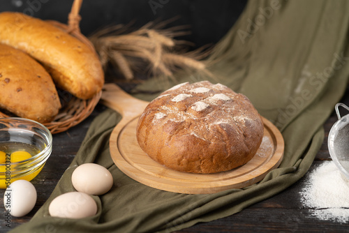 Delicious freshly baked bread on a rustic background