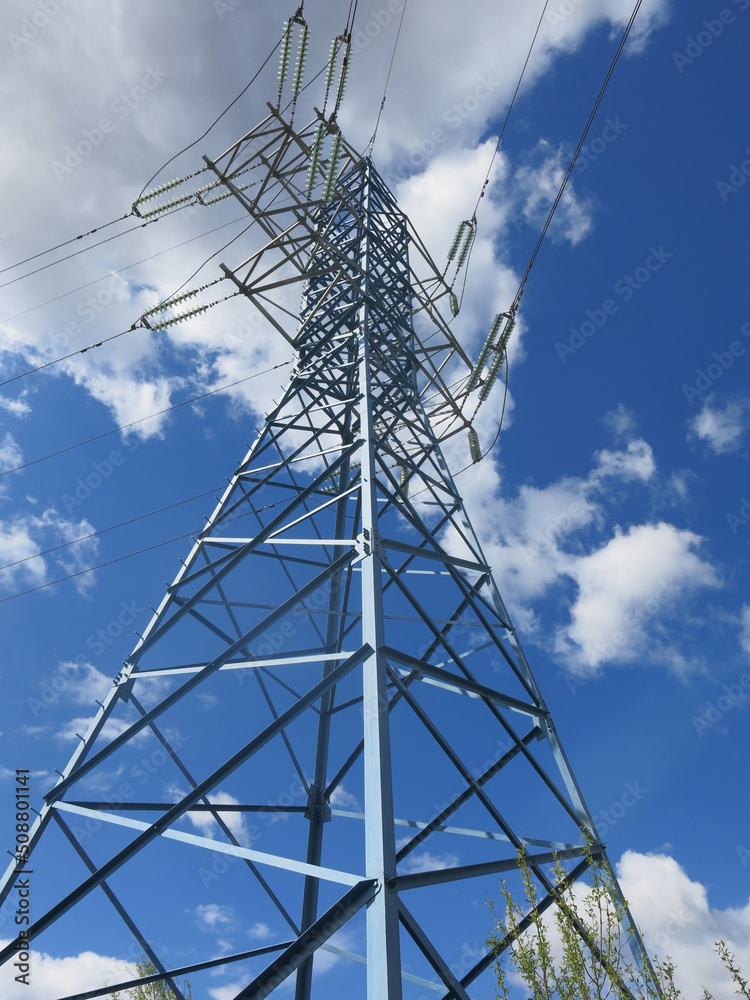 geometric design of a power line tower against a blue sky background geometric design of a power line tower against a blue sky background