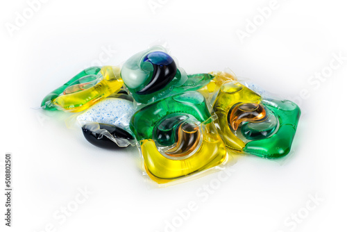Detergent in the form of multi-colored capsules for washing any laundry in washing machines on a light background