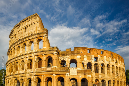 Fotobehang The Colosseum amphitheatre in the centre of the city of Rome at sunset, Italy, Europe