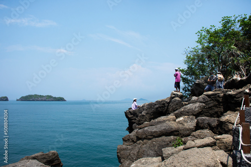 Walkway on cliff mountain for thai people foreign travelers travel visit unseen trip stone sea ​​heart in ocean on Ao Toa Ba beach of Mu Ko Petra National Park in Pak bara at La ngu in Satun, Thailand photo