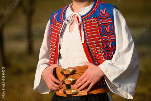 Fototapeta A man dressed in a traditional folk costume