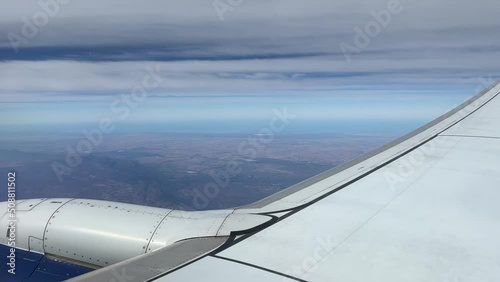 Airplane flying along the coastline with the Langeberg mountains in view photo