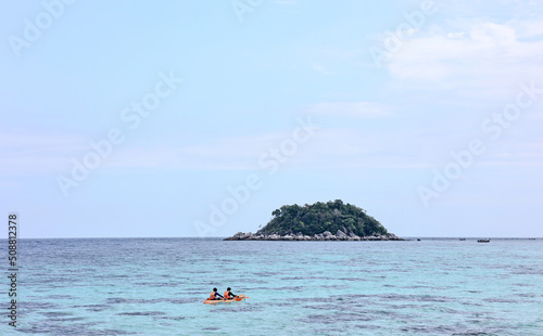 Family of father and son kayaking at Lipe or Lipe island, Satun, Southern Thailand. Summer time or vacation travel concept.