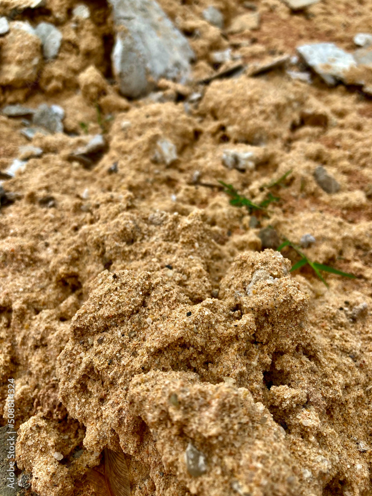 Texture : textile - soil, paving, sand used for building a house in a rural area Texture : textile - soil, paving, sand used for building a house in a rural area