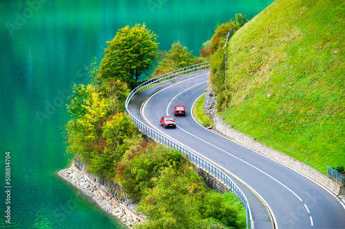 Lungern, canton of Obwalden, Switzerland. The road by the shore of the lake. A lake in a mountain valley. A popular place to travel. photo