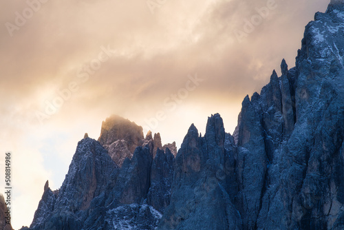 High rocks during sunset. Dolomite Alps, Italy. Mountains and cloudy skies. V...