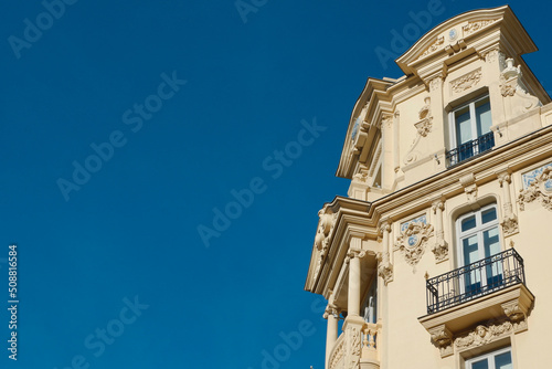 Elegant corner of classy baroque building with windows and balcony downtown Madrid, Spain