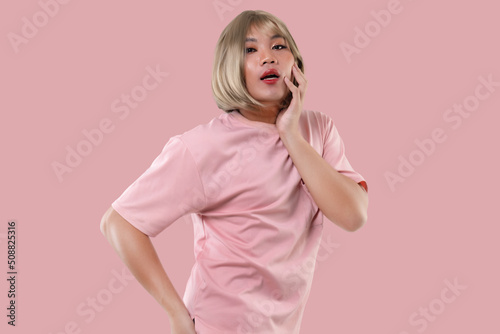 Young Asian transgender LGBT isolated over pink color background. Gender expression pride and equality concept.