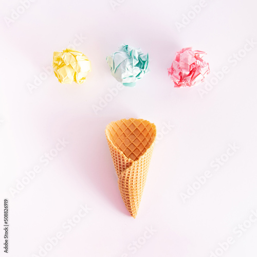 Ice cream cone and colorful balls, fruit flavors idea. Summer holiday inspired creative layout. 