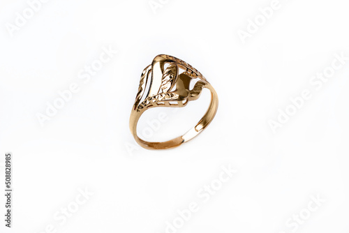 female gold ring on white background
