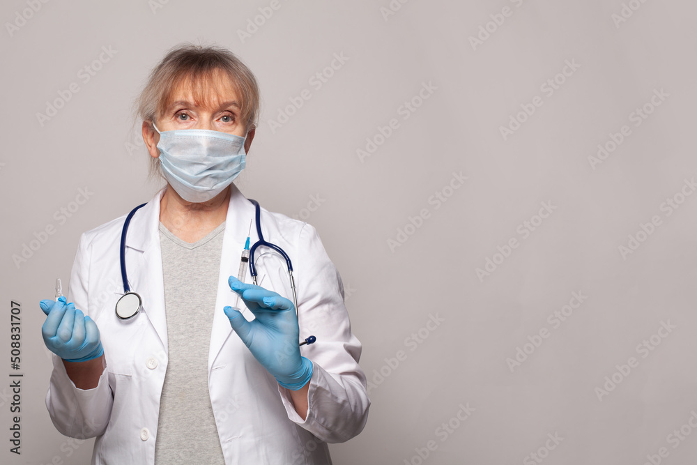 Doctor, nurse or scientist in blue gloves holding syringe and ampoule. Vaccination, medicine and treatment concept. Doctor, nurse or scientist in blue gloves holding syringe and ampoule. Vaccination, medicine and treatment concept.