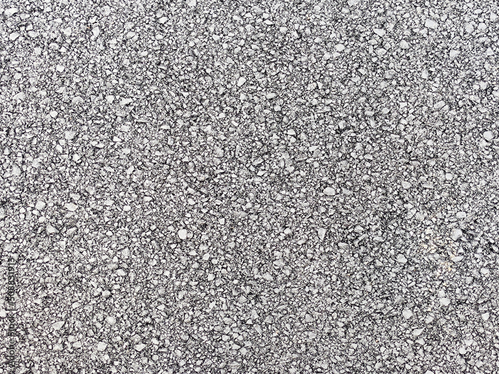 Asphalt background, sand and stones texture close view